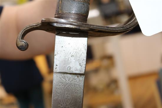 A Victorian sabre with etched blade and a mid 19th century sabre, both with scabbards